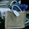 Welcome Gifts- Jute tote bags filled with pashmina, palm fan, luggage tag, water bottles, magazine, and wine.