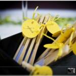 Fan Favors- Aromatherapy Bar. Three different scents were placed on a table for guests to spray their fans and enjoy cocktail hour.